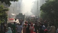 Ambulances and fire brigade vehicles gather at the site of a passenger plane crash in a residential area near an airport in Karachi, Pakistan May 22, 2020. REUTERS/Akhtar Soomro

