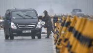 A South Korean soldier checks a van at a checkpoint on the Tongil bridge, the road leading to North Korea's Kaesong joint industrial complex, in the border city of Paju on June 24, 2020. AFP / Jung Yeon-je