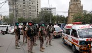 Paramilitary soldiers stand guard at the site of an attack at the Pakistan Stock Exchange in Karachi June 29, 2020. REUTERS/Akhtar Soomro