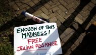 FILE PHOTO: A sign in support of WikiLeaks founder Julian Assange lies on the ground outside Woolwich Crown Court, ahead of a hearing to decide whether Assange should be extradited to the United States, in London, Britain February 25, 2020. REUTERS/Henry 