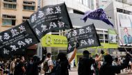 An anti-national security law protester holds a Hong Kong independence flag as he marches at the anniversary of Hong Kong's handover to China from Britain in Hong Kong, China July 1, 2020. REUTERS/Tyrone Siu