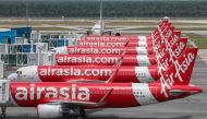 FILE PHOTO: AirAsia planes are seen parked at Kuala Lumpur International Airport 2, during the movement control order due to the outbreak of the coronavirus disease (COVID-19), in Sepang, Malaysia April 14, 2020. REUTERS/Lim Huey Teng/File Photo