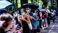 Hundreds of thousands of Hong Kong citizens wait to vote during primary elections in Hong Kong on July 12, 2020. AFP / ISAAC LAWRENCE