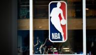 NBA logo is shown at the 5th Avenue NBA store in New York City. AFP / Jeenah Moon