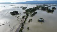 In this aerial photo inundated houses are seen in Sunamgong on July 14, 2020. Almost four million people have been hit by monsoon floods in South Asia, officials said July 14, with a third of Bangladesh already underwater from some of the heaviest rains i