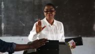 In this file photo taken on October 06, 2018 Mayor of Libreville and Gabonese Democratic Party (PDG) candidate for the local elections, Rose Christiane Ossouka Raponda, casts her vote at a polling station in Libreville, during the first round of the count