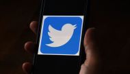 In this file photo illustration, a Twitter logo is displayed on a mobile phone on May 27, 2020, in Arlington, Virginia. Twitter says hackers 