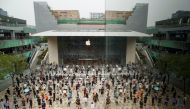 People observe social distancing as they wait for the opening of the new Apple flagship store following an outbreak of the coronavirus disease (COVID-19) in Sanlitun in Beijing, China, July 17, 2020. REUTERS/Thomas Peter