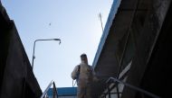 An Indonesian firefighter sprays disinfectant as a precautionary measure against the spread of the COVID-19 coronavirus in Surabaya on July 21, 2020. / AFP / Juni Kriswanto