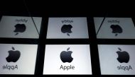 In this file photo taken on February 17, 2019 This illustration picture shows the US multinational technology company Apple logo displayed on a tablet in Paris on February 18, 2019. / AFP / Lionel BONAVENTURE