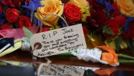 Floral tributes and messages of condolence are pictured as the funeral cortege of British football legend Jack Charlton arrives at the West Road Crematorium, in Newcastle om July 21, 2020. Jack Charlton who was born in Ashington, died on 10th July aged 85