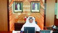 H E Ali bin Ahmed Al Kuwari, Minister of Commerce and Industry, during the video conference, yesterday.