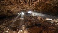 Researchers entering at a cave in Zacatecas in central Mexico, which contained stone tools and other evidence of the presence of prehistoric human populations, are seen in this image released on July 22, 2020. Devlin A. Gandy/Handout