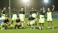 Al Duhail players posing for a photograph during a training session at the club's training pitch yesterday.