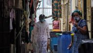 A worker from Bharatiya Jain Sanghatana, a non-governmental organization, wearing a 