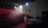 A member of the Blue Sky Rescue team disinfects a cinema in Beijing ahead of its reopening on July 24, 2020. Cinemas in most of China began reopening on July 20 after months of closures due to the COVID-19 coronavirus, with Beijing cinemas allowed to reop