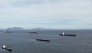 This aerial photo taken on July 25, 2020 shows Liberian cargo ships Rosa (R) and Alisa V (2nd R), two of six vessels under a quarantine order after some crew members tested positive for the COVID-19 coronavirus, anchored off the shore of Hong Kong's Lamma
