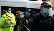 Police officers issue citation tickets to demonstrators, after police shut down a rally that was deemed unlawful, in Sydney, Australia, July 28, 2020. REUTERS/Loren Elliott