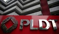 FILE PHOTO: FILE PHOTO: A logo of Philippine Long Distance Telephone Company (PLDT) is seen in front of their building in Makati city, metro Manila, Philippines May 30, 2016. REUTERS/Romeo Ranoco/File Photo