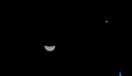 This handout photograph taken on July 27, 2020 and released by the China National Space Administration via CNS, shows a view of the Earth and Moon taken by China's Tianwen-1 Mars probe from a distance of 1.2 million kilometers. AFP PHOTO / China National 