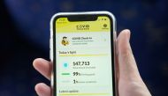 The COVID Tracker Ireland app used for contact tracing the spread of coronavirus disease (COVID-19) is displayed on a mobile phone, as it is held up for an illustration photograph in Galway, Ireland, July 30, 2020. Picture taken July 30, 2020. REUTERS/Clo