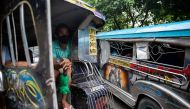 A jeepney driver who lost his livelihood amid the coronavirus disease (COVID-19) outbreak takes shelter inside a jeepney, in Quezon City, Metro Manila, Philippines, July 30, 2020. REUTERS/Eloisa Lopez