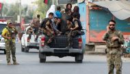 Afghan security forces transport detained prisoners who escaped from a jail after insurgents attacked a jail compound in Jalalabad, Afghanistan, August 3, 2020.REUTERS/Parwiz
 
