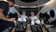 NASA astronauts Robert Behnken, left, and Douglas Hurley are seen inside the SpaceX Crew Dragon Endeavour spacecraft onboard the SpaceX GO Navigator recovery ship shortly after having landed in the Gulf of Mexico off the coast of Pensacola, Florida, U.S.,