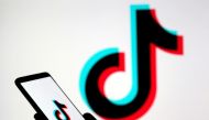 FILE PHOTO: A person holds a smartphone with the TikTok logo displayed in this picture illustration taken Nov. 7, 2019. REUTERS/Dado Ruvic/Illustration/File Photo