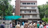 Police officers and relatives stand outside a hospital where a fire broke out inside an intensive Care Unit (ICU) treating patients infected with the coronavirus disease (COVID-19) in Ahmedabad, India, August 6, 2020. REUTERS/Stringer 