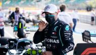 Mercedes' Finnish driver Valtteri Bottas reacts after finishing second in the qualifying session for the Formula One British Grand Prix at the Silverstone motor racing circuit in Silverstone, central England on August 1, 2020. / AFP / POOL / Will Oliver
