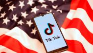 FILE PHOTO: tiktok logo is displayed on the smartphone while standing on the U.S. flag in this illustration picture taken, November 8, 2019. REUTERS/Dado Ruvic/File Photo