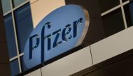 In this file photo a sign for Pfizer pharmaceutical company is seen on a building in Cambridge, Massachusetts, on March 18, 2017. Canada announced August 5, 2020 it has signed two agreements with American pharmaceutical firms Pfizer and Moderna for the de