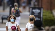 NASHVILLE, TN - AUGUST 03: Visitors to Lower Broadway, some wearing masks, walk between businesses on August 3, 2020 in Nashville, Tennessee. The number of coronavirus cases across the state has expanded rapidly in the last month. Brett Carlsen/Getty Imag