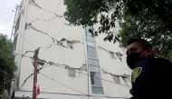FILE PHOTO: A damaged building is seen after an earthquake in Mexico City, Mexico June 23, 2020. The building had already been damaged in a 2017 earthquake. REUTERS/ Carlos Jasso
