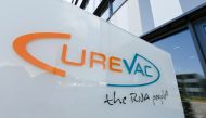 In this file photo taken on June 23, 2020 the logo of the biopharmaceutical company CureVac is seen in front of the company's headquarters in Tuebingen, southern Germany on June 23, 2020. / AFP / THOMAS KIENZLE