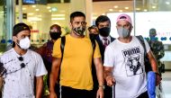 Former Captain of Indian cricket team and Captain of Chennai Super Kings, Mahendra Singh Dhoni (C), arrives from Ranchi at Birsa Munda International Airport ahead of a training session for the upcoming Indian Premier League (IPL), in Chennai. (AFP)