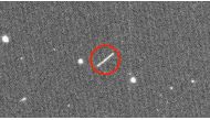This NASA/JPL/ZTF/Caltech Optical Observatories handout image obtained on August 18, 2020 shows asteroid 2020 QG (the circled streak in the center) which came closer to Earth than any other nonimpacting asteroid on record. It was detected by the Zwicky Tr