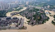 This aerial photo taken on August 19, 2020 shows a flooded area in China's southwestern Chongqing. Floods in mountainous southwest China have washed away roads and forced tens of thousands from their homes, with authorities warning on August 19 the giant 