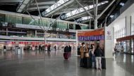 FILE PHOTO: Passangers wearing face masks ar seen at the terminal of Warsaw Chopin Airport following an outbreak of coronavirus disease in Warsaw, Poland, 13 March 2020. Dawid Zuchowicz/Agencja Gazeta/via REUTERS
