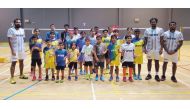 Young shuttlers with their coaches at the New Vision Badminton Sport academy in Doha.