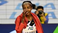 Netherland's Sifan Hassan celebrates after victory and a world record in the women's one hour event at The Diamond League AG Memorial Van Damme athletics meeting at The King Baudouin Stadium in Brussels on September 4, 2020. / AFP / MARTIN BUREAU