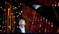 Chinese pianist Lang Lang performs during a ceremony marking the release of his new album of studio recordings and live performances of Johann Sebastian Bach's Goldberg Variations, in Beijing on September 4, 2020. AFP / GREG BAKER