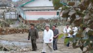 In this picture taken on September 5, 2020 and released from North Korea's official Korean Central News Agency (KCNA) on September 6, 2020 shows North Korean leader Kim Jong Un (2nd L) visiting the damaged area made by Typhoon Maysak at South Hamgyong Pro
