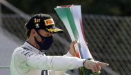  AlphaTauri's Pierre Gasly celebrates winning the Italian Grand Prix on the podium with the trophy Pool via REUTERS/Luca Bruno