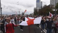 People carry a flag in 