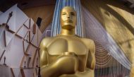 (FILES) In this file photo taken on February 8, 2020 an oscars statue is displayed on the red carpet area on the eve of the 92nd oscars ceremony at the Dolby Theatre in Hollywood, California. Hollywood's motion picture academy unveiled strict new eligibil