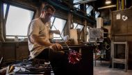 Glass master Matteo Tagliapietra shapes a glass vase at the Gambero-Tagliapietra glass art products manufacturer on September 8, 2020 in Murano. AFP / Tiziana FABI
