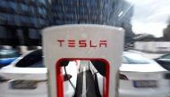 The company logo of Tesla cars is seen on the V3 supercharger equipment during the presentation of the new charge system in the EUREF campus in Berlin, Germany September 10, 2020. REUTERS/Michele Tantussi/File Photo