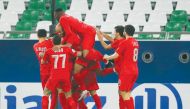 Al Duhail’s players celebrate their goal during the AFC Champions League group C match against UAE’s Sharjah, yesterday. 